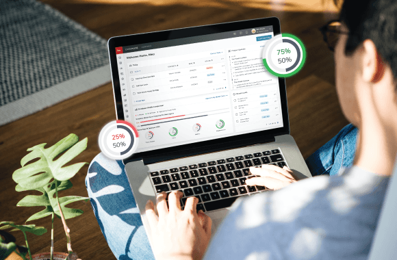 KW Command, the agent business dashboard, open on a laptop