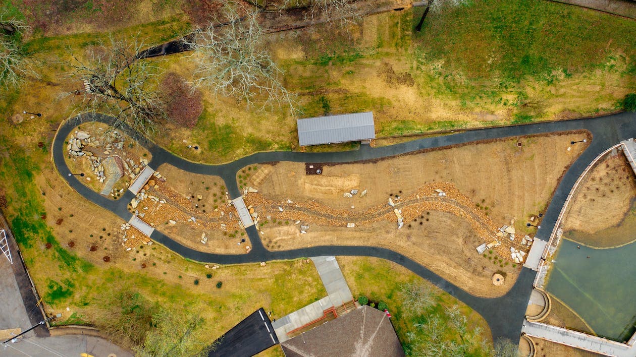 Aerial view of a winding path through open land